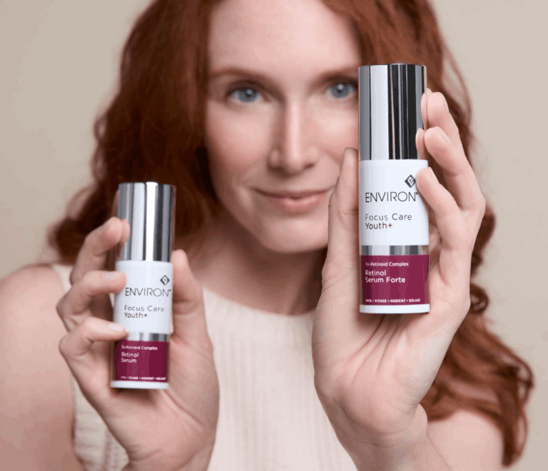 Bottle of Environ Retinol Serum and Retinol Serum Forte next to a model, highlighting Vitamin A anti-aging skincare benefits